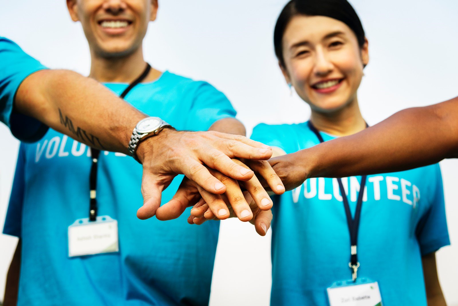 Volunteers Clasping Hands